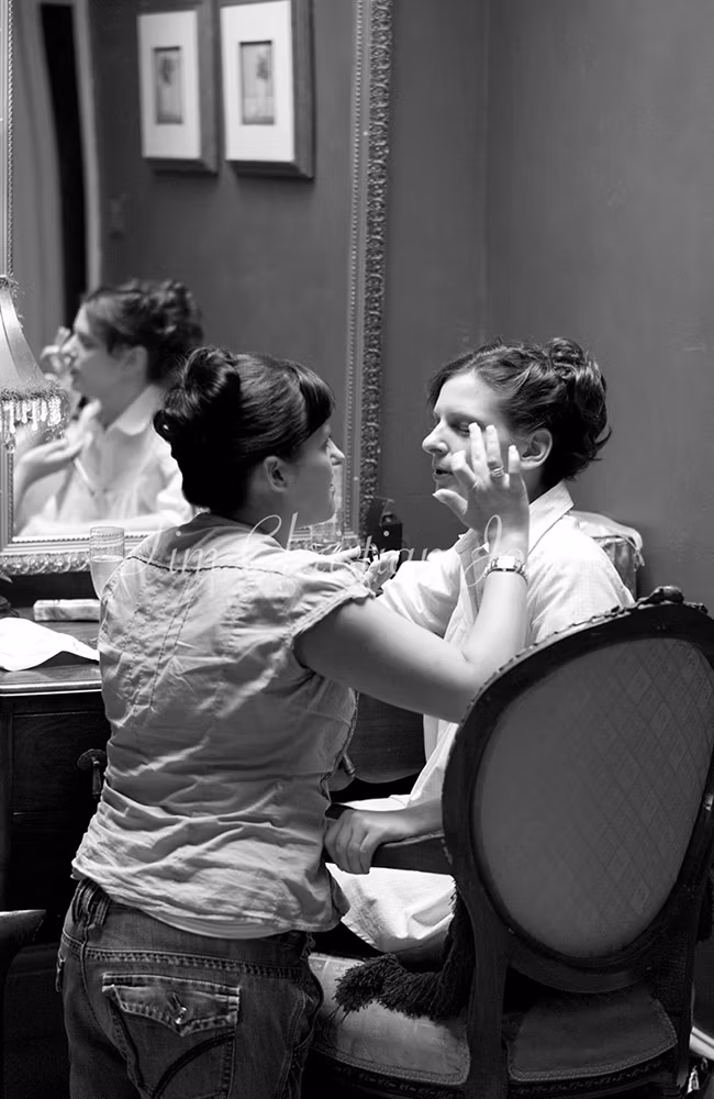 Bride and her sister helping with makeup