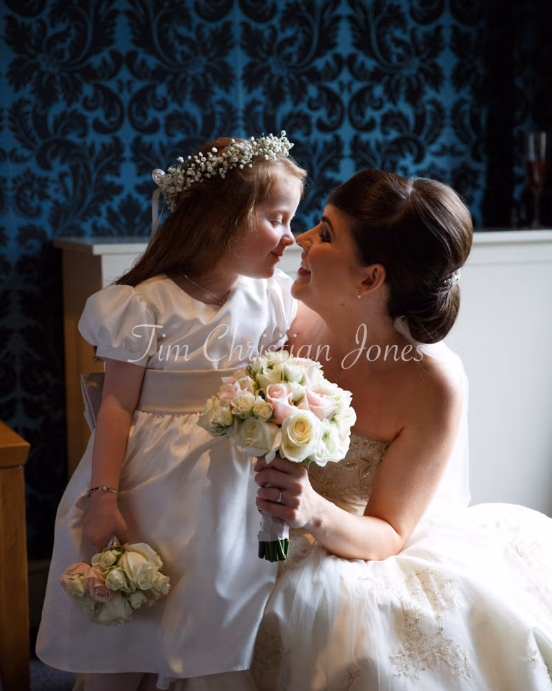 Beautiful colour photo of the bride with her daughter nose to nose, just before a Grays Court wedding