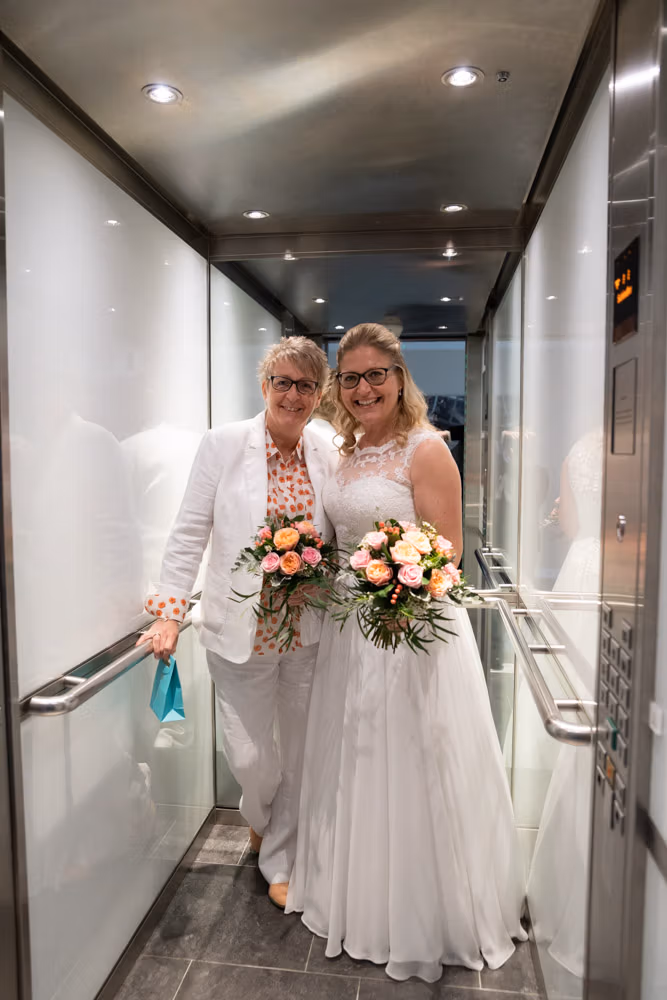 Clare and Tracey inside the lift and DoubleTree Hilton Leeds - Wedding Review