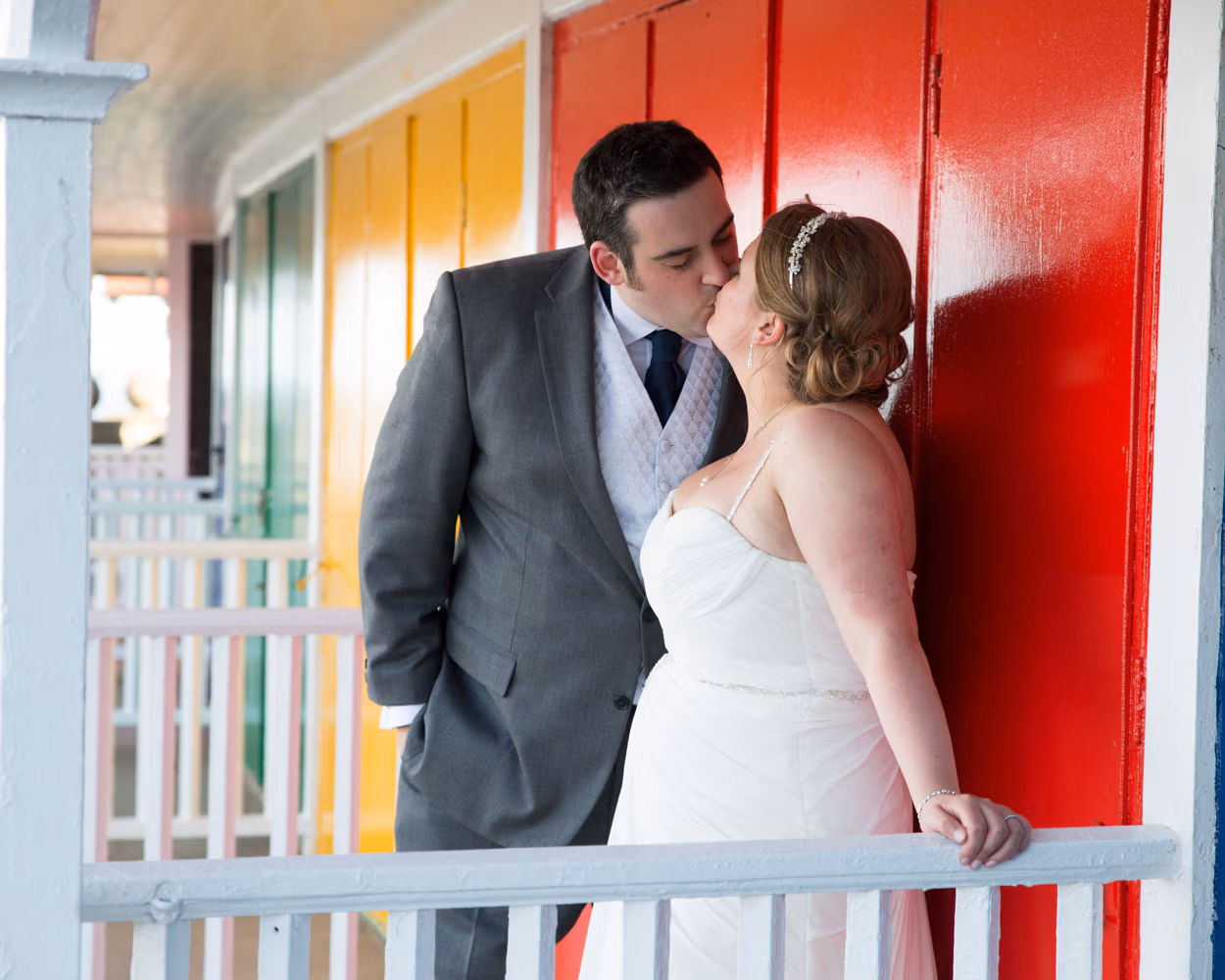 Candid wedding photography outside the Scarborough Spa, capturing relaxed, joyful moments with Lisa and Oliver