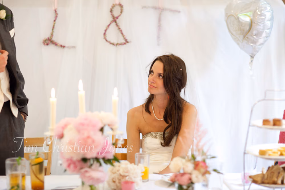 Bride Lowri looking up at her father during his speech