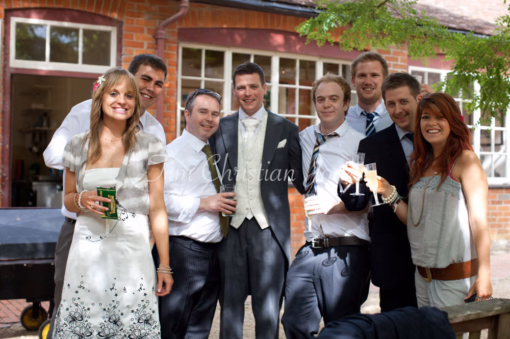 A relaxed group photo outdoors, dappled light playing across smiles