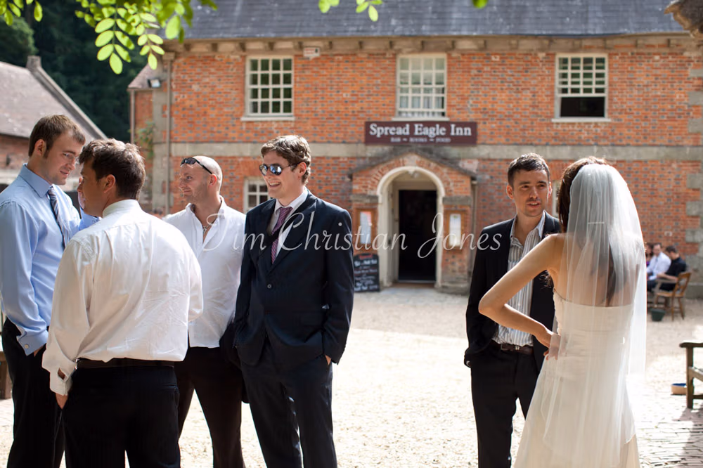 The bride chatting with guests in the golden evening light