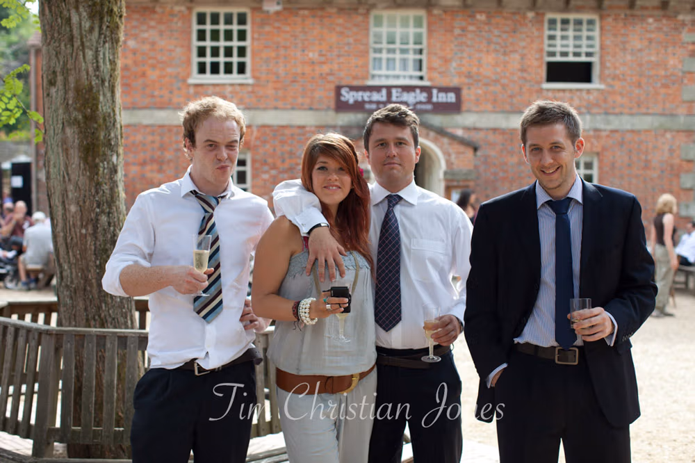 A guest makes a cheeky gesture, laughter from his girlfriend