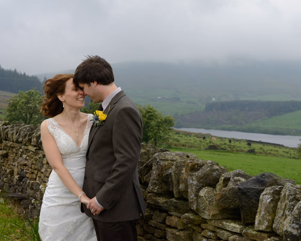 Susie and Dan's Barley Village hall wedding - a couple portrait on Pendle HIll
