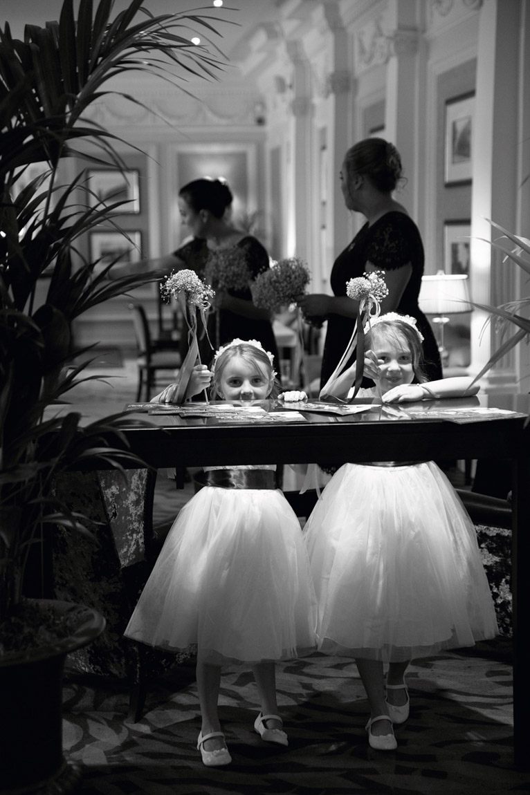 bridesmaids-peeking-over-table-wood-hall-hotel-wetherby-wedding